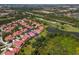 Beautiful community featuring lush landscaping, golf course views, and stunning red tile roofs at 7331 Villa D Este Dr, Sarasota, FL 34238