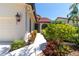 Inviting front entrance with well-maintained landscaping and charming architectural details at 7331 Villa D Este Dr, Sarasota, FL 34238