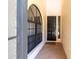 Inviting front porch with brick flooring and a stylish black front door at 7331 Villa D Este Dr, Sarasota, FL 34238