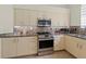 Well-appointed kitchen featuring modern appliances, granite countertops, and ample cabinet space at 7331 Villa D Este Dr, Sarasota, FL 34238