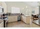 Modern kitchen featuring stainless steel appliances, granite countertops, and bright lighting at 7331 Villa D Este Dr, Sarasota, FL 34238