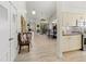 Open floor plan showcasing seamless flow from entrance to living room and dining area with modern fixtures at 7331 Villa D Este Dr, Sarasota, FL 34238