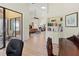 Open concept living space with tile floors, built-in shelving, and seamless access to the outdoor patio at 7331 Villa D Este Dr, Sarasota, FL 34238