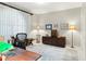 Bright office space with large window, vintage decor, and decorative area rug at 7331 Villa D Este Dr, Sarasota, FL 34238