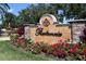 Prestancia community sign surrounded by colorful flowers and lush landscaping at 7331 Villa D Este Dr, Sarasota, FL 34238
