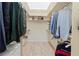 Walk-in closet with custom shelving and ample storage space at 7331 Villa D Este Dr, Sarasota, FL 34238