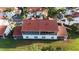 Aerial view of a condo with a screened balcony, overlooking a well-maintained lawn at 7532 Marsh Orchid Cir # 8-201, Bradenton, FL 34203