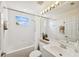 Well-lit bathroom with a shower/tub combo, vanity, and mirrored wall at 7532 Marsh Orchid Cir # 8-201, Bradenton, FL 34203