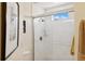 Modern bathroom with tile shower and glass door provides natural lighting at 7532 Marsh Orchid Cir # 8-201, Bradenton, FL 34203