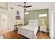 Light and airy bedroom with a ceiling fan and ensuite bathroom at 7532 Marsh Orchid Cir # 8-201, Bradenton, FL 34203