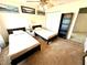 Cozy bedroom with two beds, a ceiling fan and closet for storage at 7532 Marsh Orchid Cir # 8-201, Bradenton, FL 34203