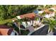 Beautiful condo featuring a red tile roof, lush landscaping, and ample parking spaces at 7532 Marsh Orchid Cir # 8-201, Bradenton, FL 34203