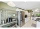 Modern kitchen featuring stainless steel appliances, white cabinetry, and spacious design at 7532 Marsh Orchid Cir # 8-201, Bradenton, FL 34203