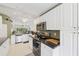 Bright and spacious kitchen with modern appliances and open floor plan to living area at 7532 Marsh Orchid Cir # 8-201, Bradenton, FL 34203