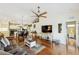 Inviting open-concept living room featuring hardwood floors and an adjacent kitchen at 7532 Marsh Orchid Cir # 8-201, Bradenton, FL 34203