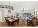 Spacious living room with hardwood floors, high ceilings, and access to balcony at 7532 Marsh Orchid Cir # 8-201, Bradenton, FL 34203