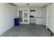Spacious garage with double doors, built-in shelving, and ample storage space at 754 Spanish S Dr # 754, Longboat Key, FL 34228