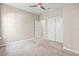 Bedroom featuring ceiling fan and adjacent bathroom at 8272 Summer Night Rd, Sarasota, FL 34241