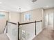 Bright hallway with carpet and stylish staircase view at 8272 Summer Night Rd, Sarasota, FL 34241