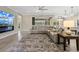 Comfortable living room with a large flat-screen TV, fireplace, and plush seating, creating a cozy atmosphere at 8272 Summer Night Rd, Sarasota, FL 34241