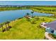 Scenic pond with a wooden pier and picnic area, providing a tranquil space for residents to relax and enjoy nature at 8272 Summer Night Rd, Sarasota, FL 34241