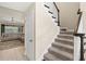 Inviting staircase with carpeted steps and decorative wooden banister, leading to the upper level at 8272 Summer Night Rd, Sarasota, FL 34241