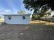 The backyard offers a well-sized lawn with fence, trees and plenty of room for outdoor activities at 8291 57Th N St, Pinellas Park, FL 33781