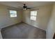 Cozy bedroom featuring two windows and neutral colored carpet at 8291 57Th N St, Pinellas Park, FL 33781
