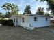 Charming exterior of a single-story home with white paint and well-maintained landscaping at 8291 57Th N St, Pinellas Park, FL 33781