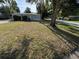 Charming single-story home featuring a lush front yard and mature trees, offering great curb appeal at 8291 57Th N St, Pinellas Park, FL 33781