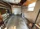 Spacious garage with an automatic door, shelving, and ample storage space at 8291 57Th N St, Pinellas Park, FL 33781