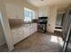 View of kitchen showcasing white cabinetry and stainless steel appliances at 8291 57Th N St, Pinellas Park, FL 33781
