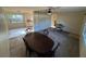 Open floorplan with dining table, built-in shelving, and multiple windows at 8291 57Th N St, Pinellas Park, FL 33781
