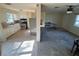 Open concept living area with tiled kitchen and living room, and ceiling fan at 8291 57Th N St, Pinellas Park, FL 33781
