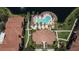 Overhead view of the pool, palm trees, and lake creating a private oasis within the community at 8341 38Th Street Cir E # 303, Sarasota, FL 34243