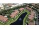 Beautiful community aerial view features a serene lake, lush landscaping, fountains, and well-maintained buildings at 8341 38Th Street Cir E # 303, Sarasota, FL 34243
