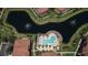 Scenic aerial view showcasing the lake and fountains enhancing the community's picturesque setting at 8341 38Th Street Cir E # 303, Sarasota, FL 34243