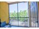Relaxing screened balcony with seating and lush views at 8341 38Th Street Cir E # 303, Sarasota, FL 34243