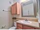Cozy bathroom features a single sink, cabinet, medicine cabinet and neutral color palette at 8341 38Th Street Cir E # 303, Sarasota, FL 34243