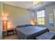 Bright bedroom featuring a ceiling fan and a window, creating a cozy atmosphere at 8341 38Th Street Cir E # 303, Sarasota, FL 34243