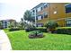 Inviting common area features a picnic table, green grass and walkways at 8341 38Th Street Cir E # 303, Sarasota, FL 34243