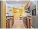 Open kitchen with stainless steel appliances, wooden cabinets, and view into adjacent area at 8341 38Th Street Cir E # 303, Sarasota, FL 34243