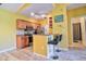 Bright kitchen featuring wood cabinets, stainless steel appliances, and breakfast bar seating at 8341 38Th Street Cir E # 303, Sarasota, FL 34243