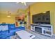 Open floor plan showcasing living room leading to the kitchen and dining area with bar seating at 8341 38Th Street Cir E # 303, Sarasota, FL 34243