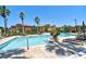 Resort-style pool featuring ample lounge seating, beautiful landscaping, and well-maintained surrounding buildings at 8341 38Th Street Cir E # 303, Sarasota, FL 34243