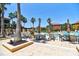 Community pool with plenty of tables, chairs and lounge chairs at 8341 38Th Street Cir E # 303, Sarasota, FL 34243