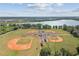 Aerial view of a well-maintained baseball field with multiple diamonds and a central building at 9008 Brookfield Ter, Bradenton, FL 34212