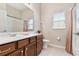 Clean and bright bathroom featuring a vanity with drawers, neutral tile, and shower-tub combo at 9008 Brookfield Ter, Bradenton, FL 34212