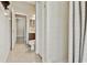 Bathroom featuring tiled floors, a walk-in shower with tile surround, and a vanity with drawers and cabinets at 9008 Brookfield Ter, Bradenton, FL 34212
