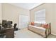 Comfortable bedroom with a daybed, closet, and window with blinds, ideal for a guest room or office at 9008 Brookfield Ter, Bradenton, FL 34212
